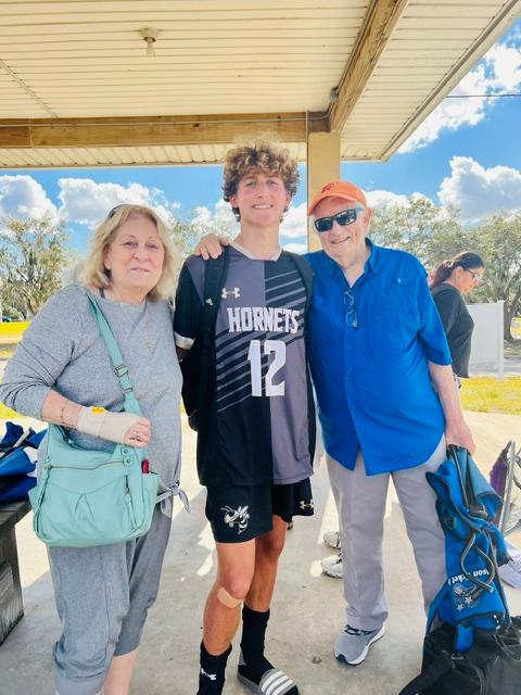 Sandy and Bill Dunn III with grandson Liam V
